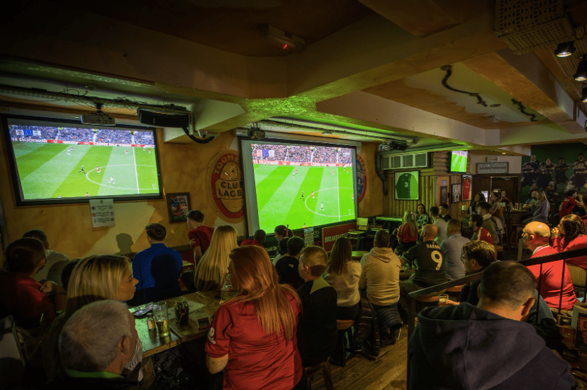 Fans watching the big screens in The Woolshed pub in Cork city